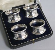 A set of four George V silver napkin rings, G.F. Westwood & Sons, Birmingham, 1918, in fitted box.