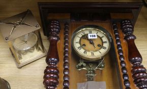 A wall clock and a mantel clock