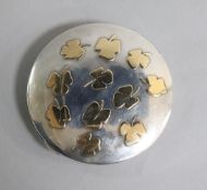 A 1930's Danish 925 parcel gilt silver compact by Michelsen, decorated with foliage, 9cm.