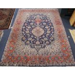 A Tabriz blue medallion rug 222 x 156cm.