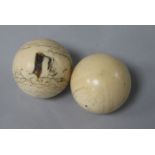 2 ivory billiard balls