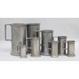 Eight French Provincial graduated pewter measures