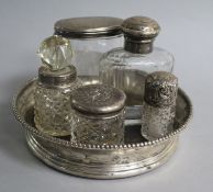 Five silver topped jars and a Dutch silver mounted wine coaster.