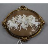 A Victorian gold mounted oval cameo brooch carved with figures and winged horses, 81mm.