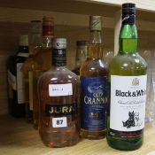 Seven assorted bottles of whisky: Ballantines, Dewars, Grants Family Reserve, Glencrannog, Black and