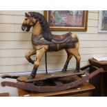 A Toy horse mounted on rockers Height 85cm.