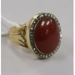 A Victorian gold, carnelian and rose cut diamond set oval dress ring, size S.