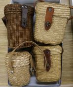 Four travelling glasses in wicker containers