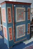 A painted and decorated cupboard dated 1804 123cm. H.174cm.