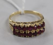 A 14ct gold and ruby double-row ring, size P.