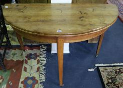A French fruitwood demi lune fold out dining table 124cm.