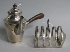 A late Victorian silver bachelor's cafe au lait pot and a later silver toastrack.