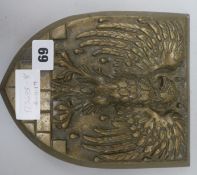 A brass eagle plaque