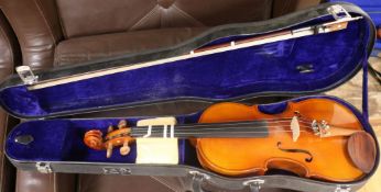 A Stentor ¾ violin, with case and a half size violin