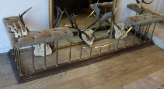 A brass and oak club fender, with buttoned fawn leather upholstered seat W.225cm