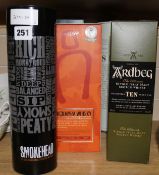 Five assorted bottles of whisky: Ardbeg 10yo, Lagavulian 16yo, Smoke Head, Waitrose Islay 10yo and