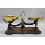 A pair of 19th century brass and iron scales and weights