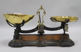 A pair of 19th century brass and iron scales and weights