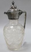 An Edwardian silver plated engraved glass claret jug