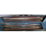 Ten assorted violin bows in a case