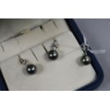 A Mikimoto suite of 18ct white gold, cultured Tahitian pearl and diamond jewellery, comprising a