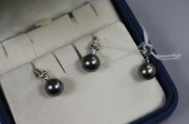 A Mikimoto suite of 18ct white gold, cultured Tahitian pearl and diamond jewellery, comprising a