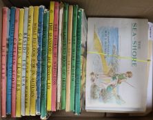 A collection of 16 Ladybird books and seven albums of tea and cigarette cards, the Ladybird books