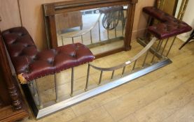 An iron and brass mounted red buttoned leather upholstered club fender W.178cm