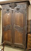 Carved oak armoire H.228cm