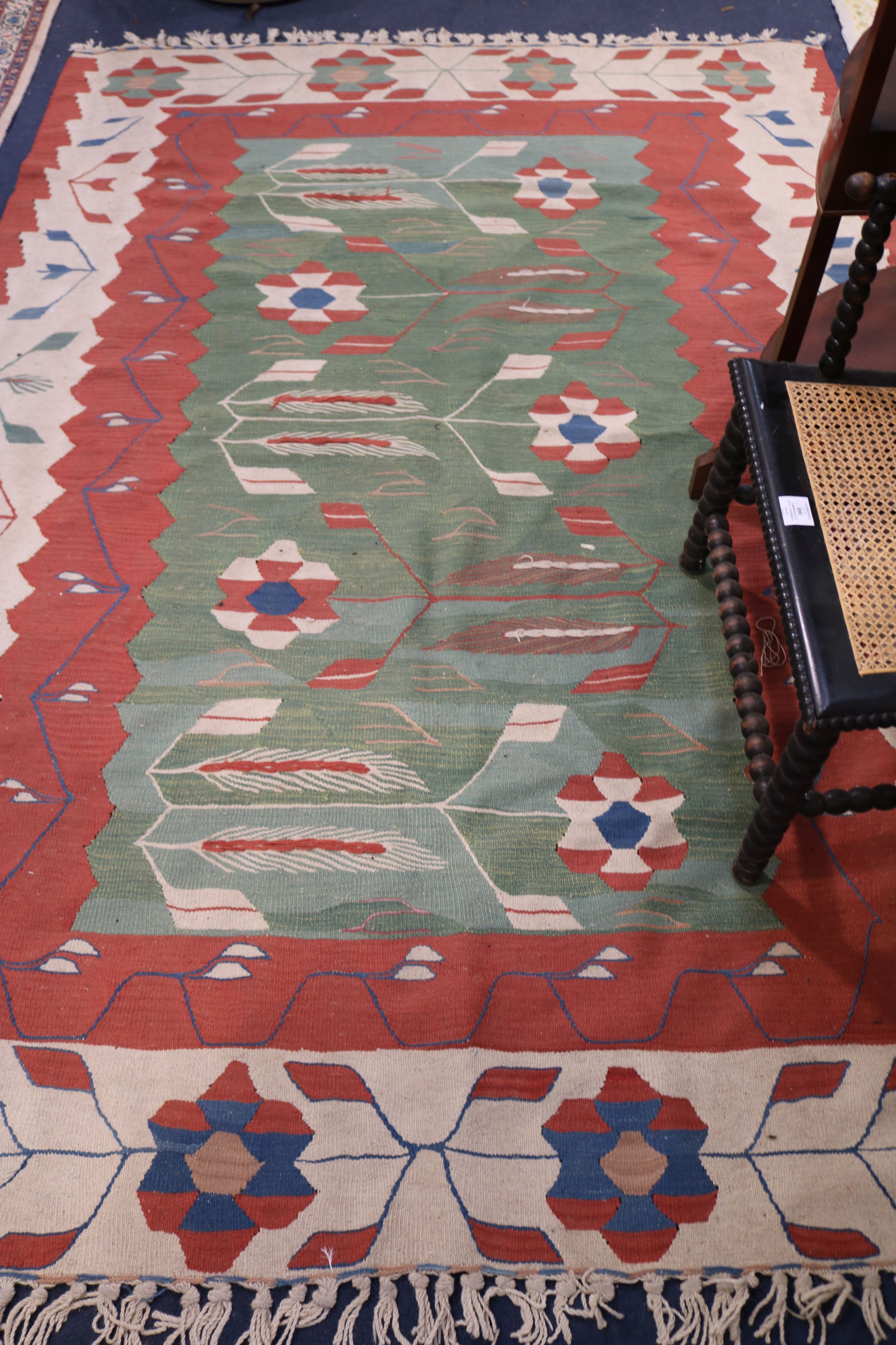 A Kelim rug 243 x 166cm and a pair of wool rugs