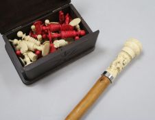 A bone chess set and a bone topped walking stick