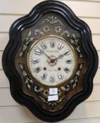 A Fichter and Aubert ebonised wall clock