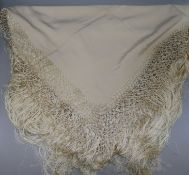 A 1920's christening shawl in lacquered box