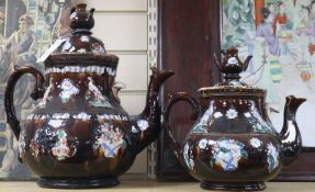 Two Measham pottery 'barge' teapots