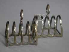 A pair of George V silver five bar toast racks.