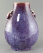 A Chinese flambe glaze pear shaped vase, hu, late 19th / early 20th century, the shoulder modelled