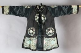 A Chinese black satin 'crane medallion' jacket, early 20th century, replacements to sleeves