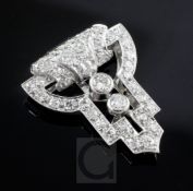 A 1930's Art Deco white gold and diamond set clip brooch, of geometric openwork design, 28mm.