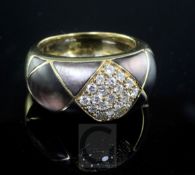 A modern gold, diamond and paua shell? set dress ring, size O.