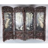 An impressive Japanese carved wood, ivory and Shibayama four-fold screen, by Kobayashi, Meiji