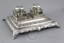 An ornate late 19th/early 20th century Portuguese 833 standard silver inkstand, with two mounted