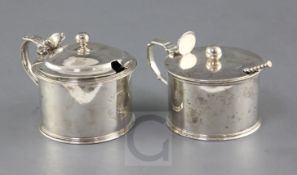 Two George IV silver drum mustards by William Eaton, with engraved crests, London, 1820 and two