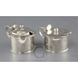 Two George IV silver drum mustards by William Eaton, with engraved crests, London, 1820 and two