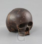 An antique European carved softwood model of a skull, 3in.