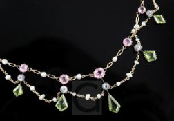 An Edwardian 15ct gold and multi gem set fringe necklace, including peridot, pink tourmaline and