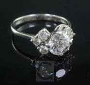 An 18ct white gold and single stone diamond ring with diamond set shoulders, the central stone