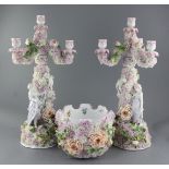 A pair of German floral encrusted porcelain three branch candelabra and a matching monteith, late