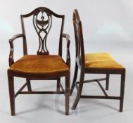 A set of eight George III Hepplewhite style mahogany dining chairs, including two carvers, with