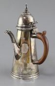 An Edwardian 18th century style Brittania standard silver cafe au lait pot by Charles Stuart Harris,