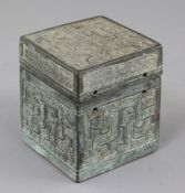 A Chinese archaic bronze square box and cover, Eastern Zhou dynasty, 6th-5th century B.C., cast in